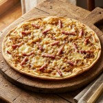 découvrez notre recette gourmande de tartes flambées aux oignons caramélisés et fromage fondant, une délicieuse spécialité à savourer sans attendre.